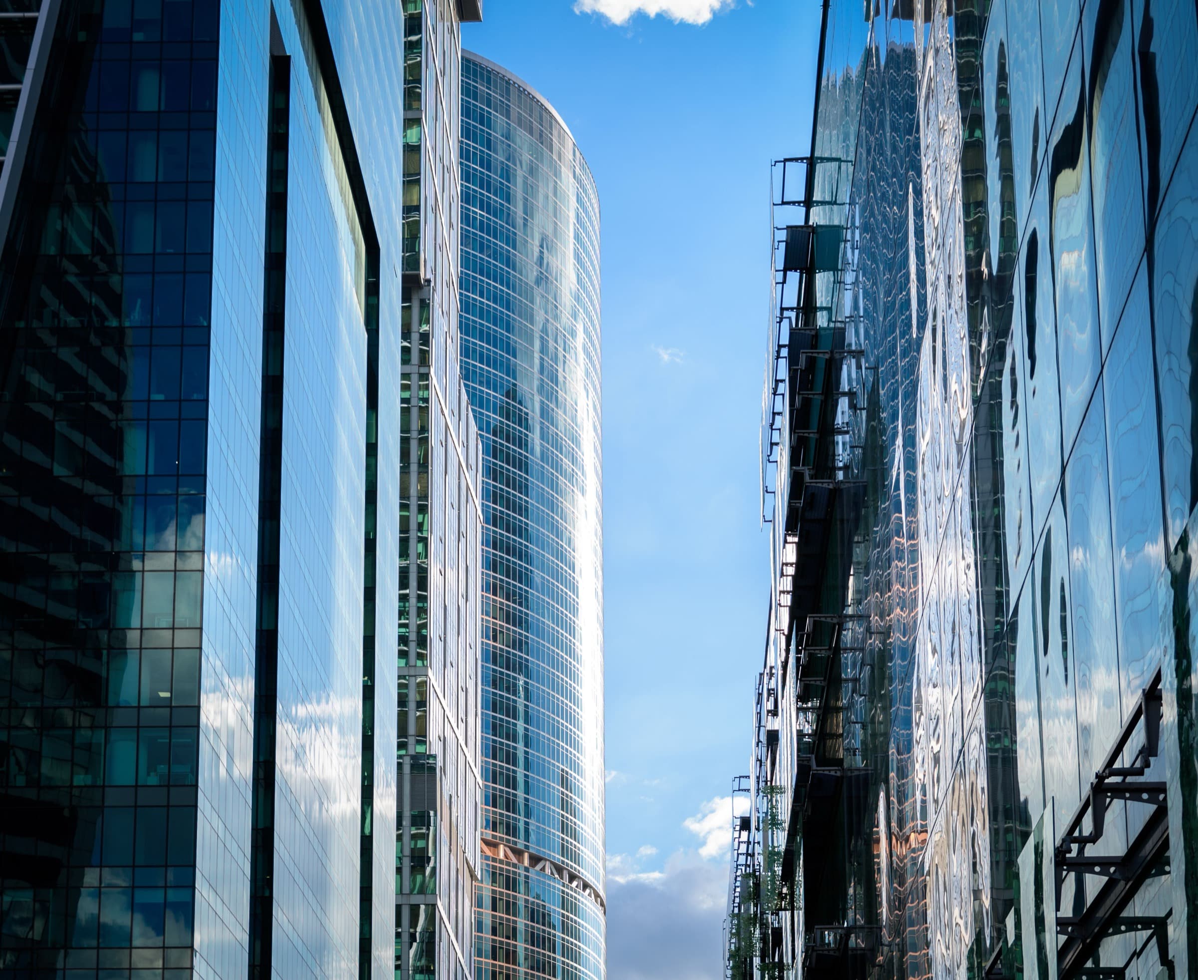 Glass towers rising against a clear sky